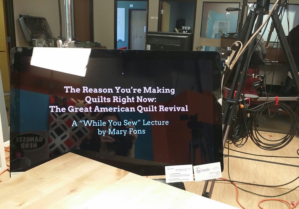 The view of my monitor on set today. Look closely and you'll see a quilt reflected in the glass (and me taking the shot.) Outside of Denver. 